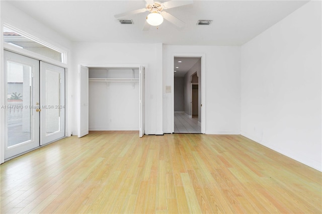 unfurnished bedroom with light hardwood / wood-style floors and ceiling fan