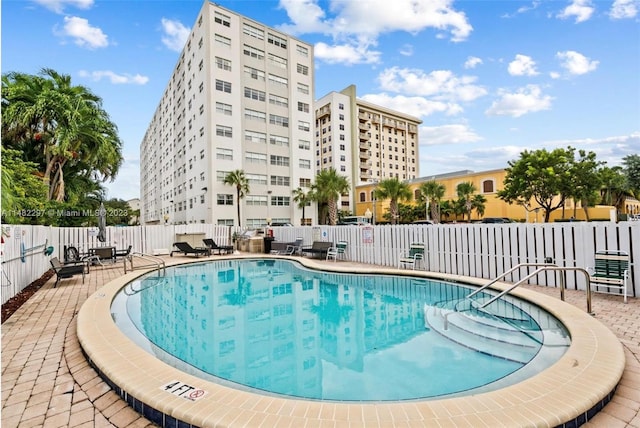 view of swimming pool with a patio