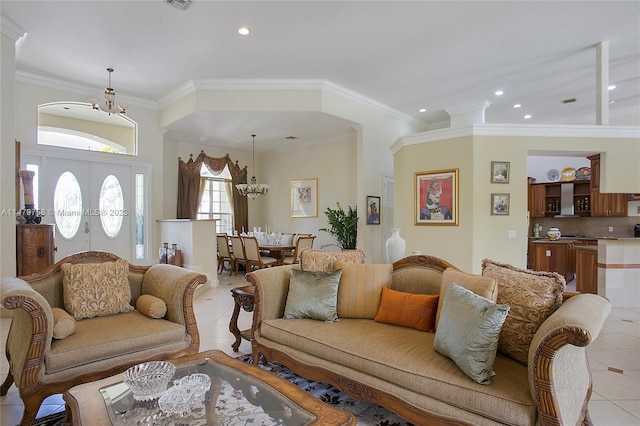 living room with light tile flooring, a notable chandelier, and crown molding