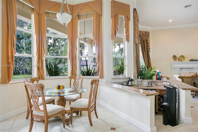 tiled dining room with crown molding