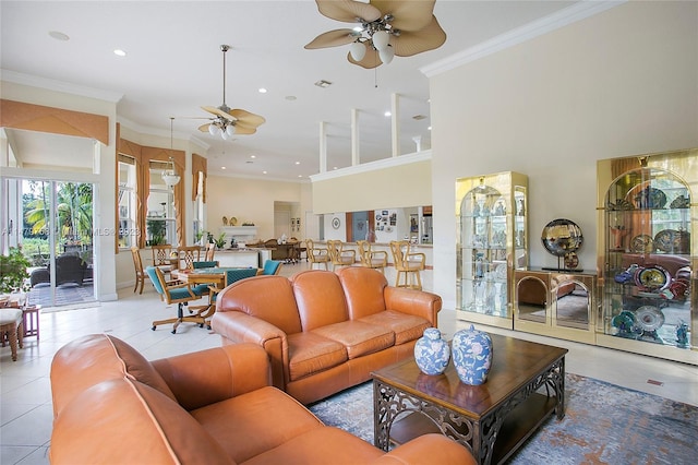 living room featuring light tile floors, crown molding, and ceiling fan