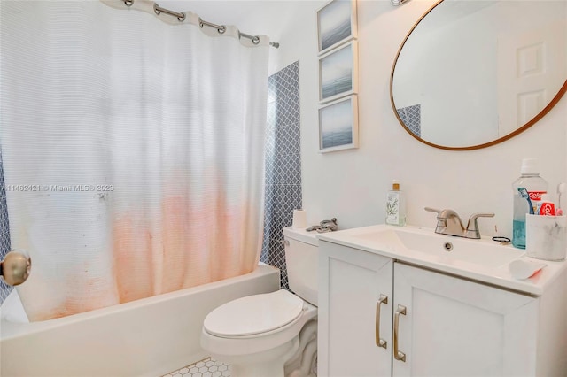 full bathroom featuring toilet, tile floors, shower / tub combo with curtain, and vanity