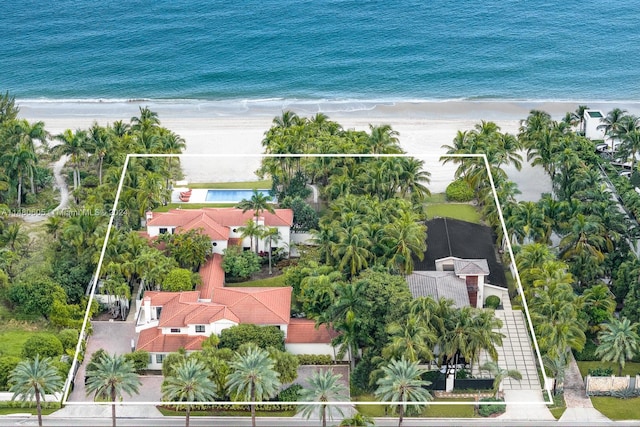 aerial view with a beach view and a water view