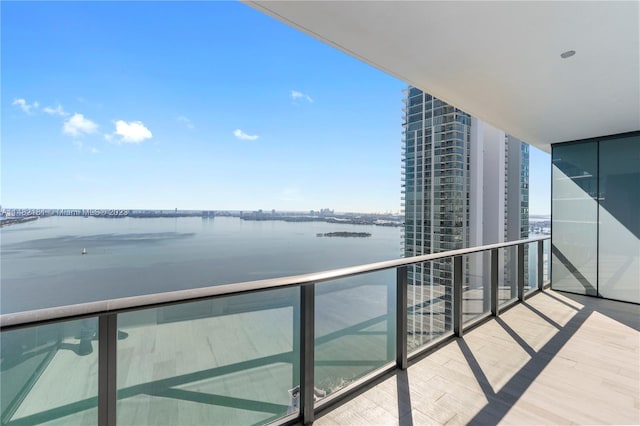 balcony featuring a water view