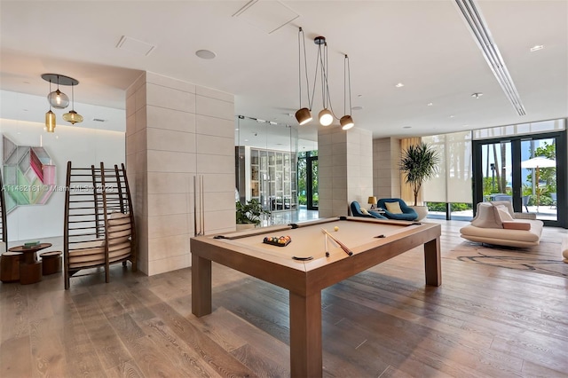 rec room with wood-type flooring, pool table, expansive windows, and french doors