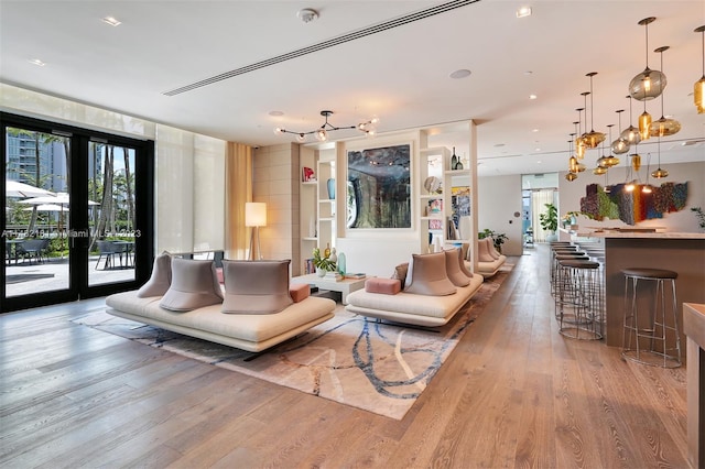 living room featuring plenty of natural light and hardwood / wood-style flooring