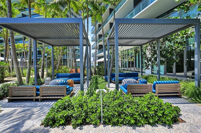 view of terrace with an outdoor living space and a pergola