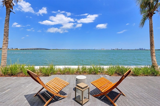 view of terrace featuring a water view