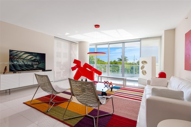 tiled living room featuring a wall of windows