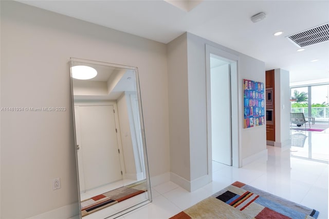 hallway with light tile flooring