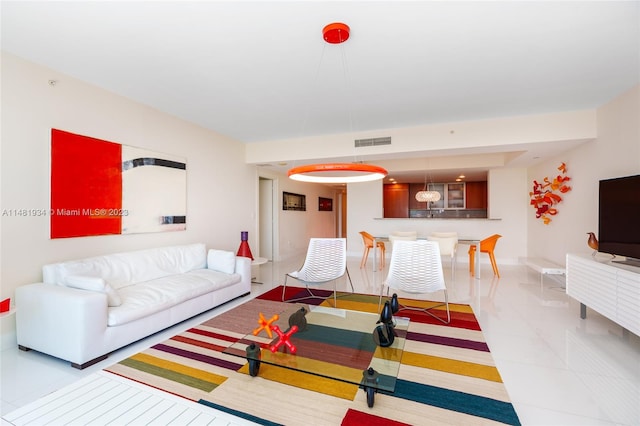 living room featuring light tile floors