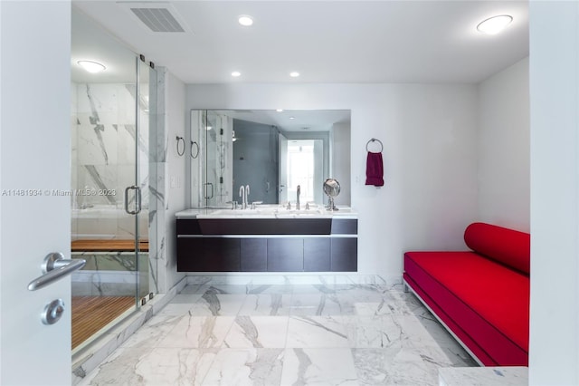 bathroom with walk in shower, oversized vanity, and tile flooring