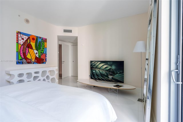 bedroom featuring light tile floors