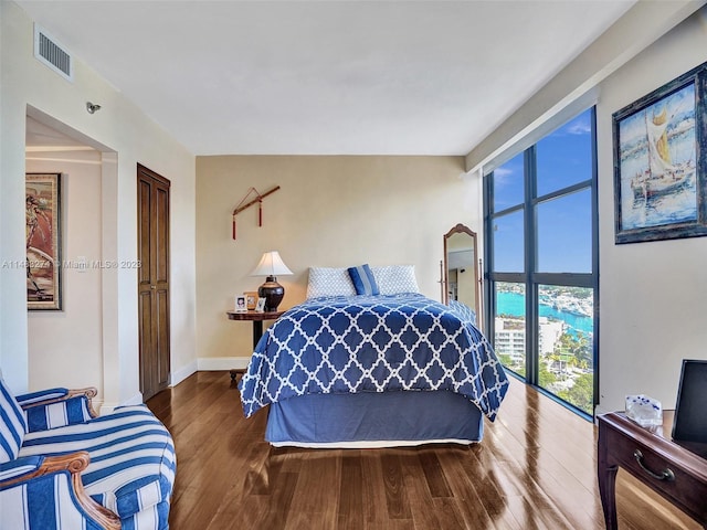 bedroom with hardwood / wood-style floors