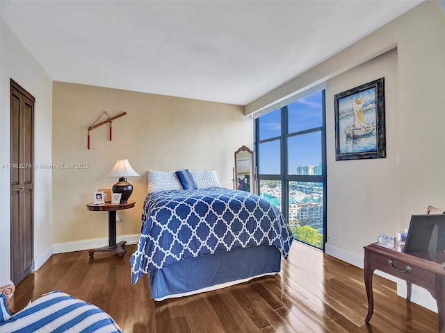 bedroom with hardwood / wood-style floors