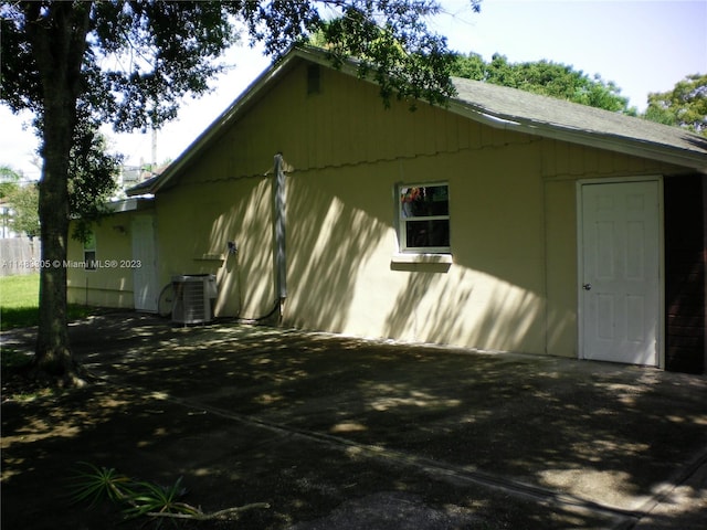 view of side of property with central AC