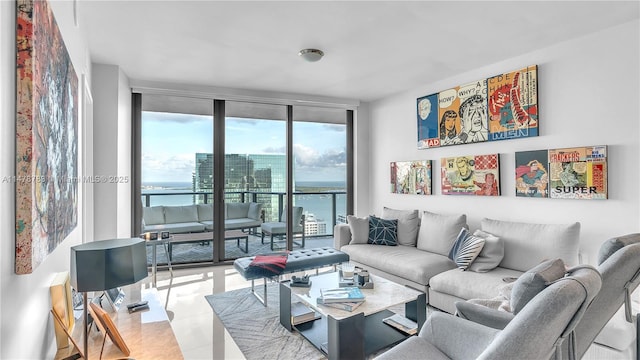 living room featuring light tile patterned flooring, expansive windows, and a water view