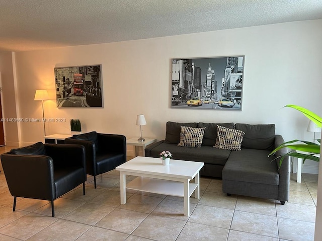 tiled living room featuring a textured ceiling