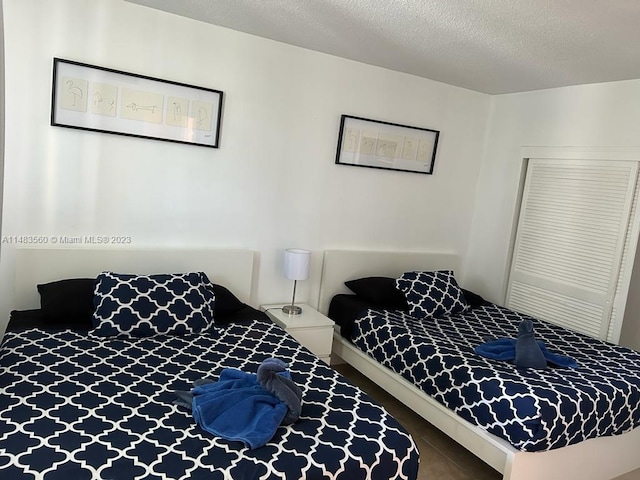 bedroom featuring a textured ceiling