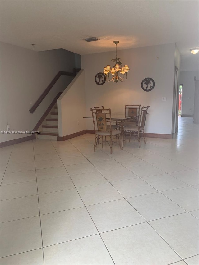 unfurnished dining area featuring light tile flooring and a notable chandelier