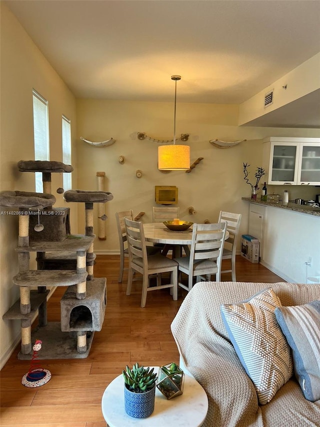 dining area featuring light wood-type flooring