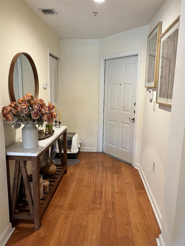 hall featuring wood-type flooring