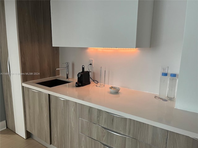 kitchen featuring light hardwood / wood-style flooring and sink