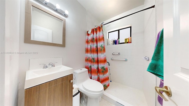 bathroom with vanity, a shower with shower curtain, and toilet