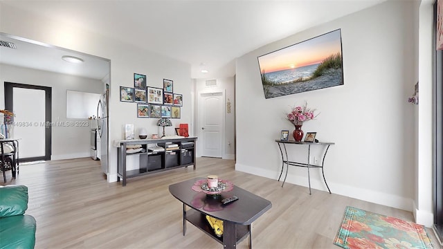 living room with light hardwood / wood-style floors