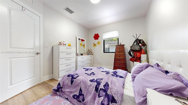 bedroom with light hardwood / wood-style flooring