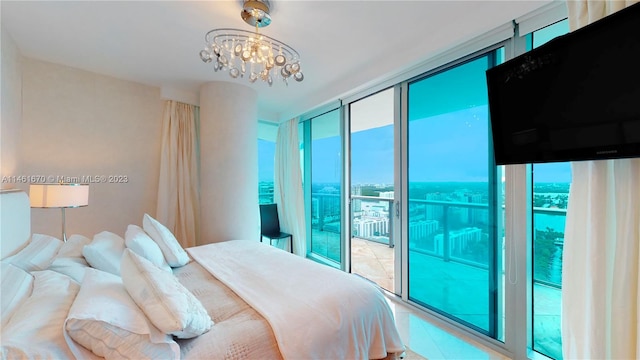 bedroom featuring floor to ceiling windows, light tile flooring, access to exterior, and a chandelier