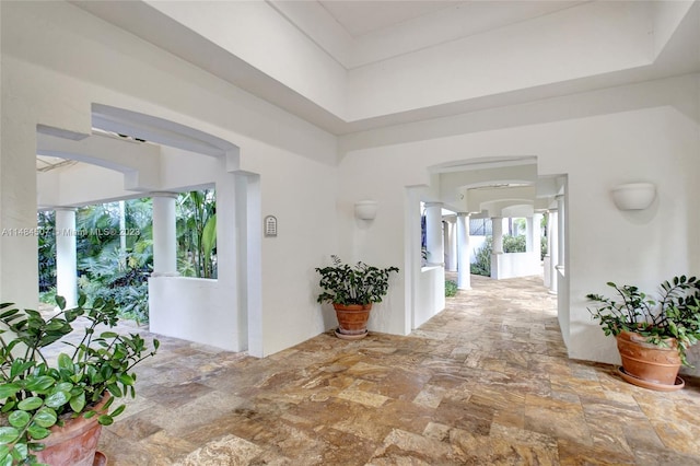 hallway featuring light tile floors