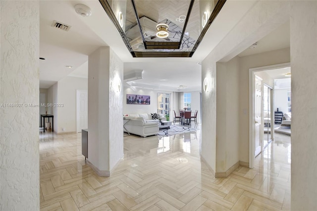 hall with light parquet floors