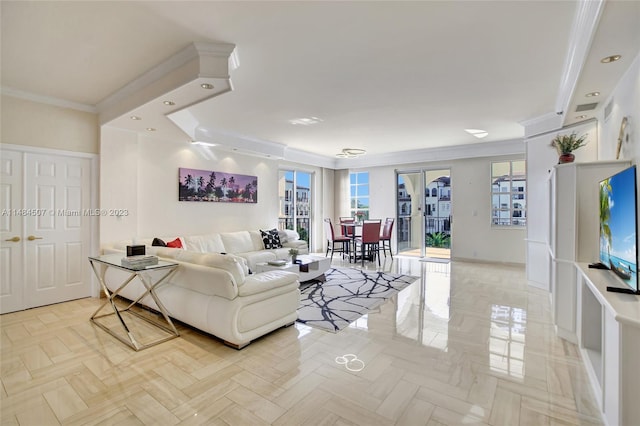 living room with light parquet floors, a tray ceiling, french doors, and ornamental molding