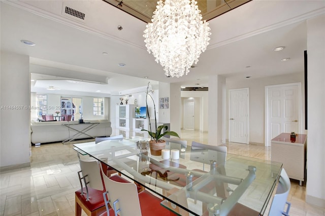 dining room featuring an inviting chandelier, a tray ceiling, and light tile floors