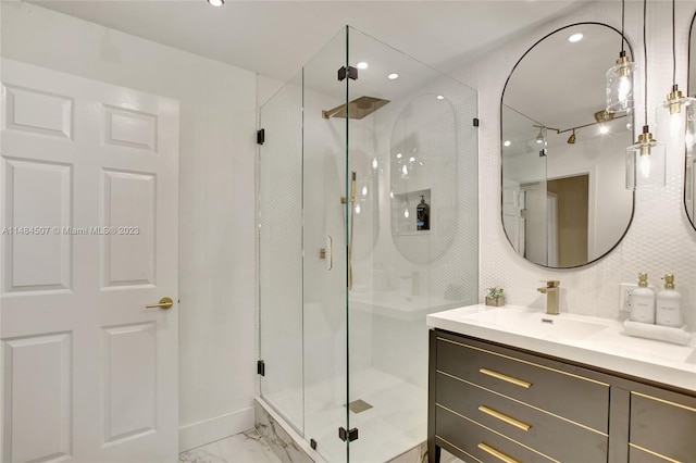 bathroom with vanity with extensive cabinet space, tile floors, and an enclosed shower