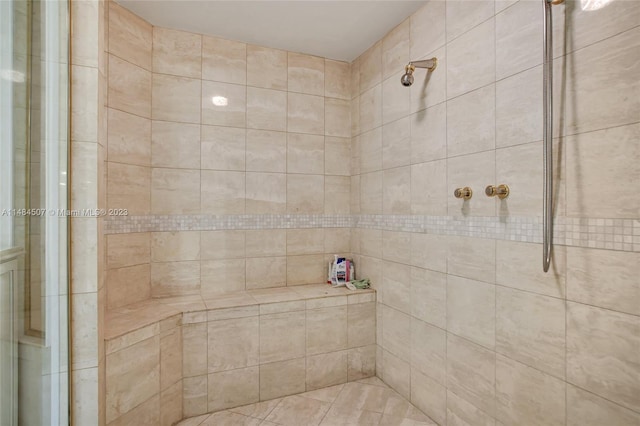 bathroom with tiled shower