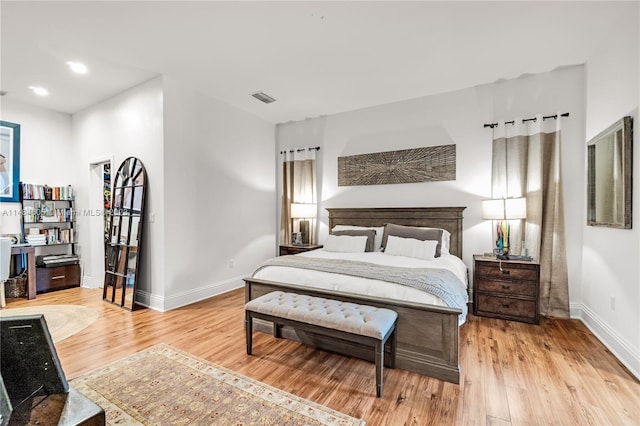 bedroom with light hardwood / wood-style flooring