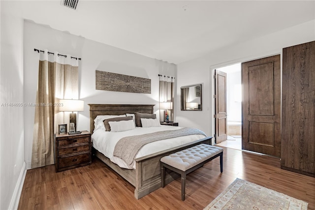 bedroom with light hardwood / wood-style flooring