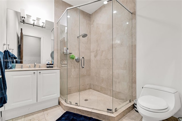 bathroom featuring vanity, walk in shower, tile flooring, and toilet