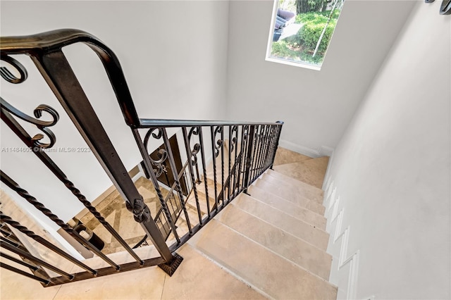 stairway with light tile floors