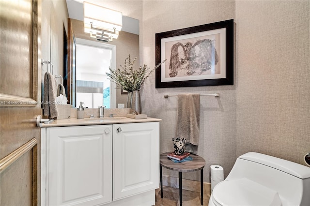 bathroom with vanity and toilet