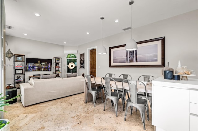 dining space featuring light tile flooring