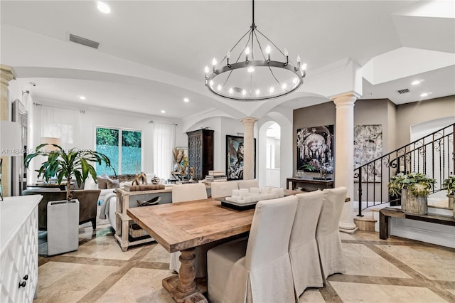 tiled dining area with decorative columns, a notable chandelier, and ornamental molding