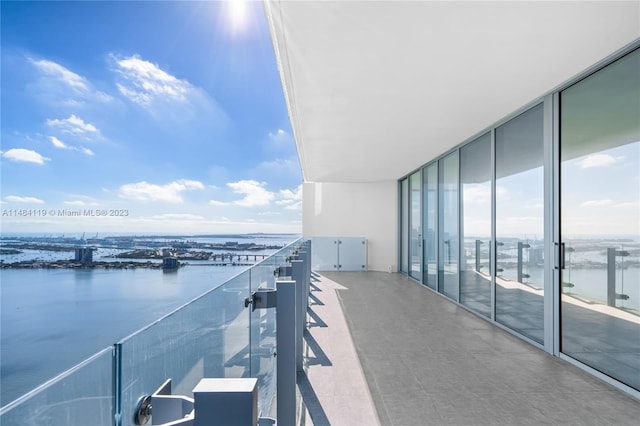 balcony featuring a water view