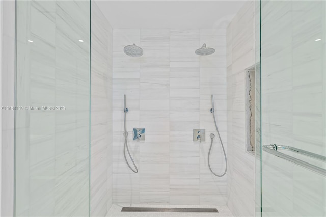 bathroom with tiled shower