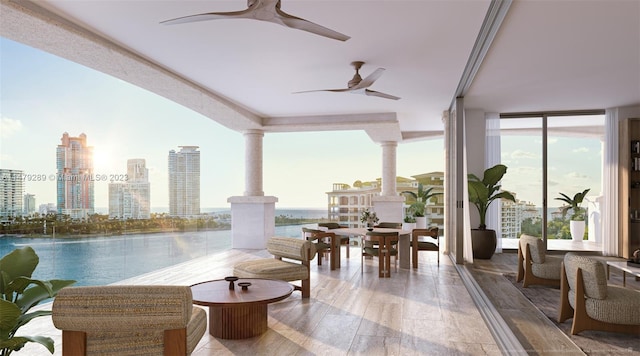 view of patio / terrace with a water view and ceiling fan