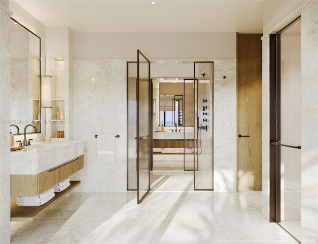 bathroom with tile floors, large vanity, and tile walls