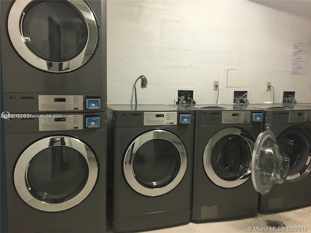 clothes washing area with washer hookup, washing machine and dryer, and stacked washing maching and dryer