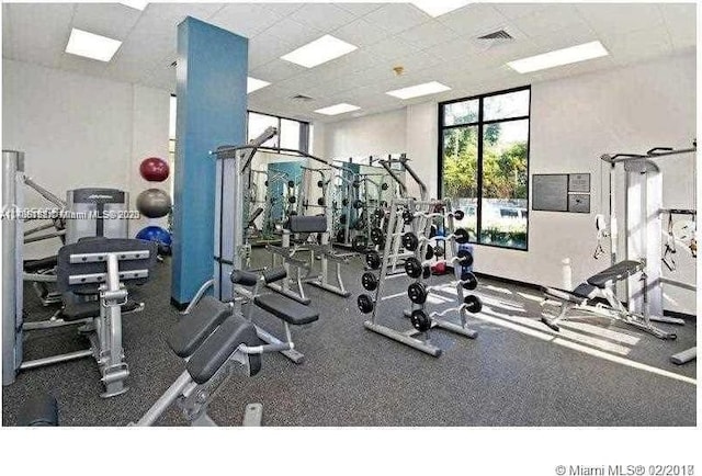 workout area featuring a paneled ceiling